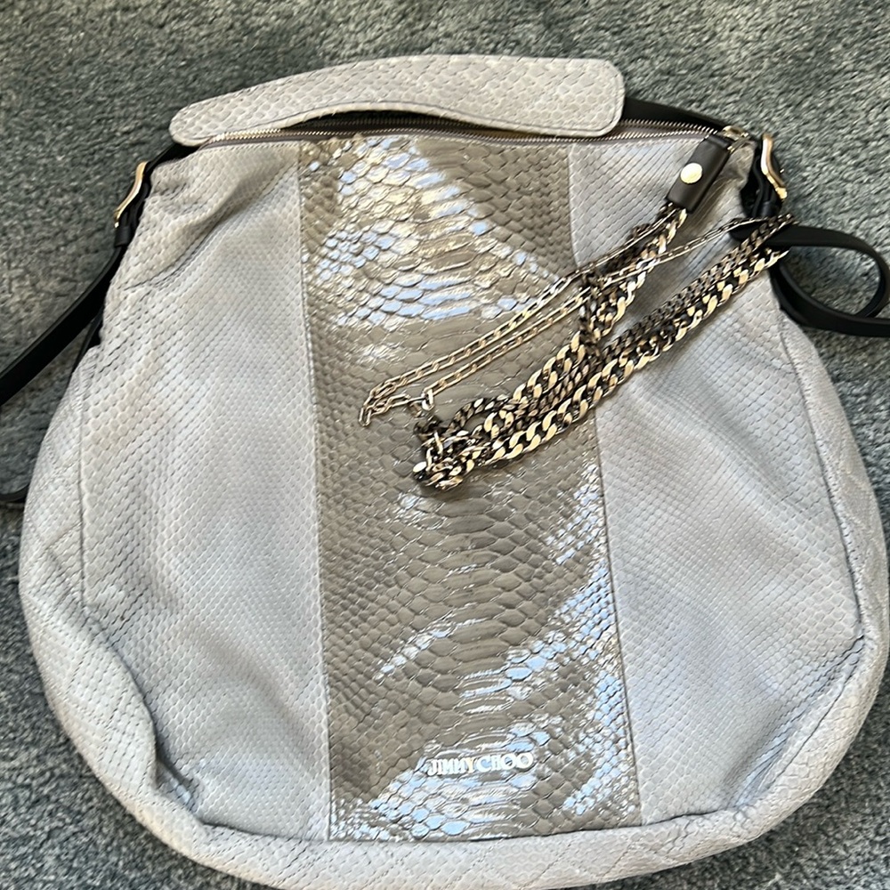 Brand new snakeskin Jimmy Choo purse in mint condition